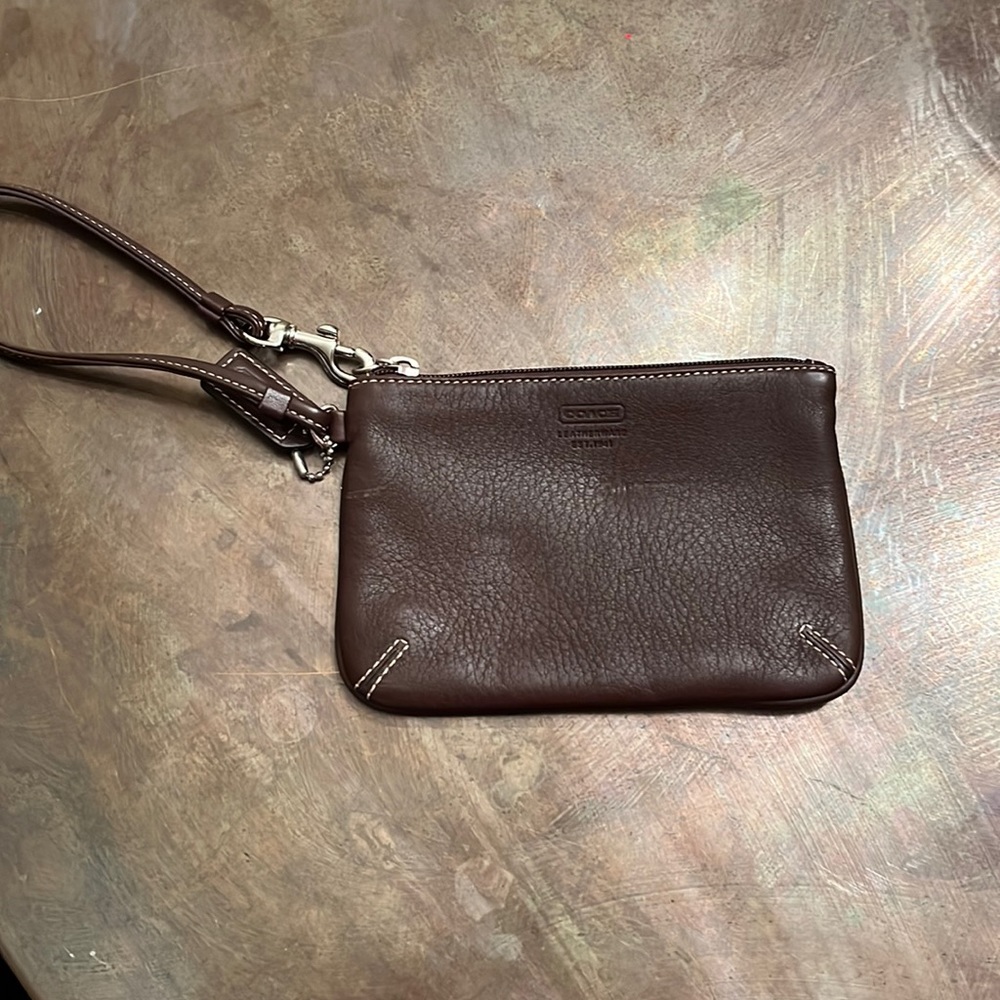 Brown leather coach wristlet